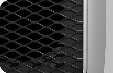 Gros plan sur la grille de sortie d'air du chauffage